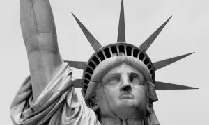 black and white photo of statue of liberty head and arm
